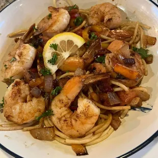a plate of shrimp and pasta