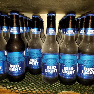 a bunch of bud light beer bottles