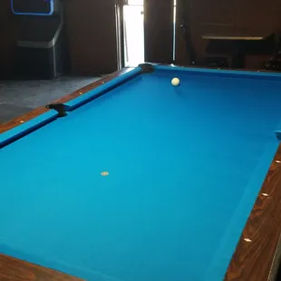 a pool table in a game room