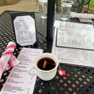 a cup of coffee and menu