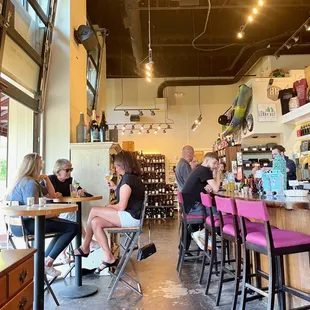 a group of people sitting at a bar