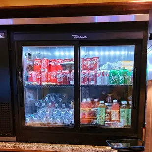 Beverages and snacks are available including popcorn and hotdogs.