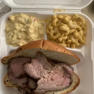 80z tri-tip sandwich with a side of Mac and cheese and potato salad