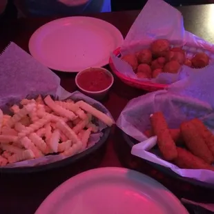 Fries, breaded mushrooms, and cheese sticks. Mushrooms are a must!