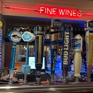 a row of beer taps