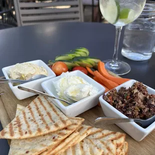 Dip Board - Hummus, Whipped Feta &amp; Olive Tapenade with gluten free flatbread crust made into crackers.