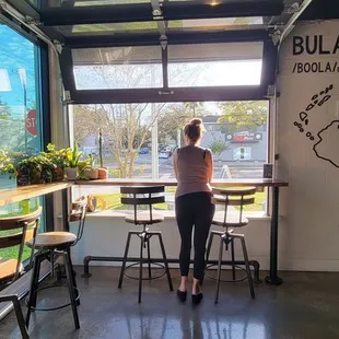 Seating area with open window to street. Nice touch!