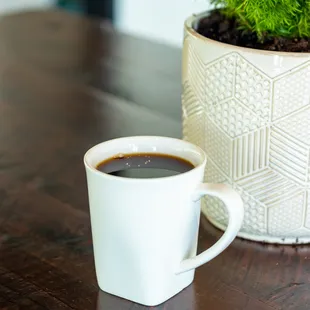 a cup of coffee on a table