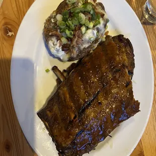 Baby back ribs and fully loaded baked potato