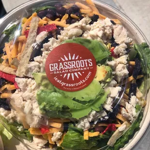 a salad in a plastic bowl