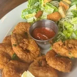 Fried shrimp with a side salad