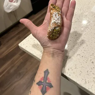 Small, palm sized BITTER $9 Mistake, aka cannoli. NEVER order this!!