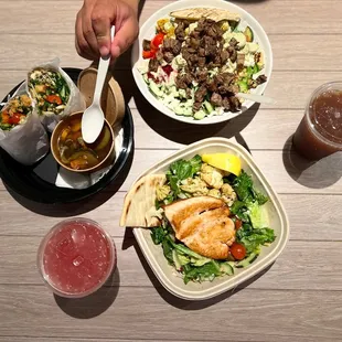 a person eating a salad and a drink