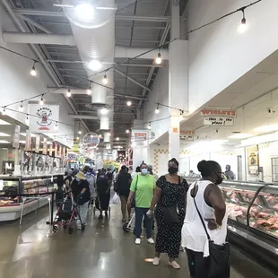 people shopping in a grocery store