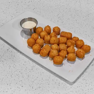 a plate of fried chicken nuggies