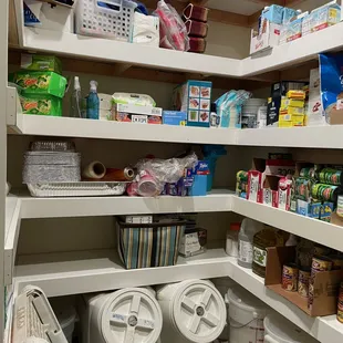 Walk in pantry build inside a garage. Insulated with varied depth shelves for heavy bags and canned goods.