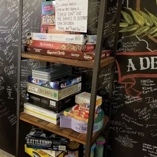 a chalkboard wall with writing on it