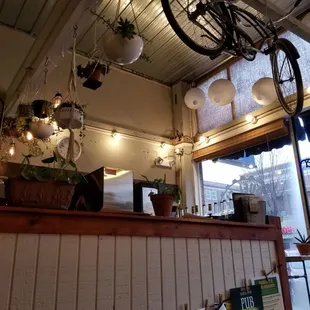 a bicycle hanging from the ceiling