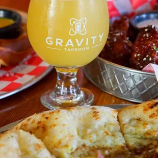a glass of beer and a plate of food
