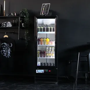 merch and refrigerator with there signature to-go glass bottle.