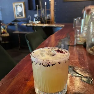 a drink sitting on a bar top