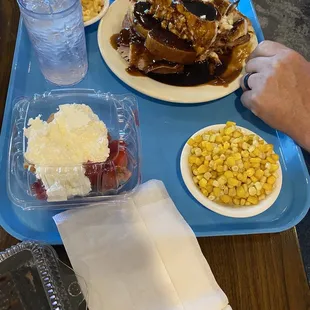 a blue tray with food on it