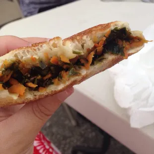 Stuffed "pancake" from one of the booths. More like an english muffin with asian-y veggies inside. Different, but good!
