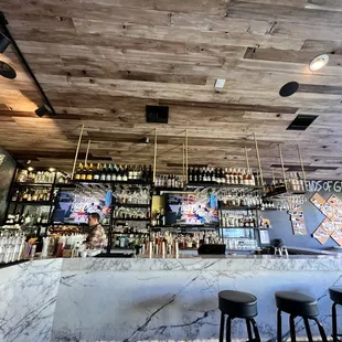 Inside Gray Tavern w/ a fully stacked bar