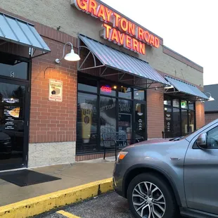 a car parked in front of the restaurant