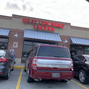 cars parked in front of the restaurant
