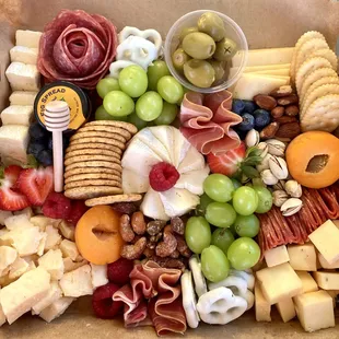 Charcuterie boxes! Easily transported and can be delivered!