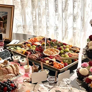 Large Gone Grazey board (bridal shower) with many sauces, dips, crackers, breads.