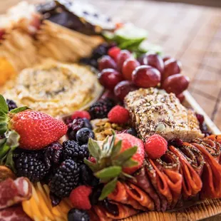 a platter of fruit and cheese