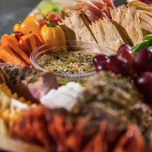 a platter of meats and vegetables