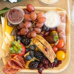 a platter of fruit and cheese