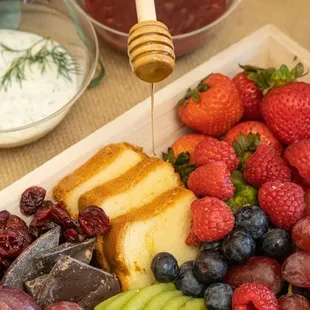 a platter of fruit and cheese