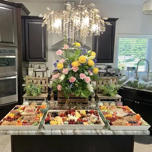 a large kitchen island with a variety of food on it