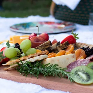 a platter of fruit and cheese