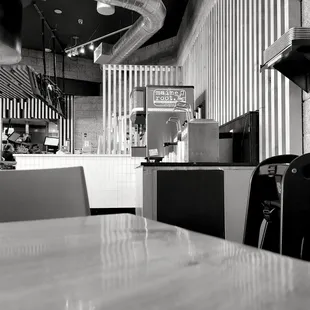 a black and white photo of a restaurant