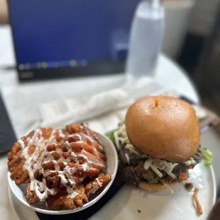 a plate of food and a laptop