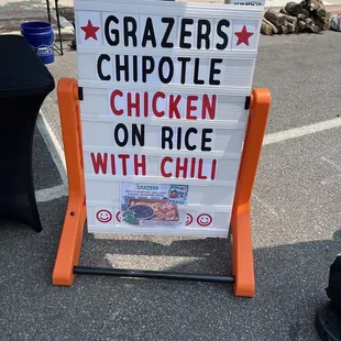 a sign for a chicken on rice with chili