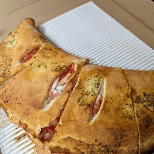 Hawaiian calzone, amazing! Seasoned crust. Huge!