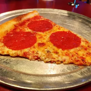 a slice of pepperoni pizza