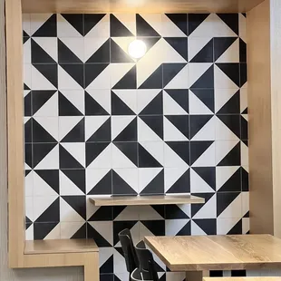 a black and white tiled wall