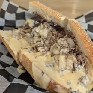 Steak and cheese dripping with homemade cheeze whiz. Awesome.