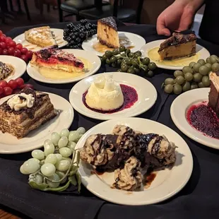 Dessert tray: tiramisu, cannolo, chocolate peanut butter torte, key lime tart, and more