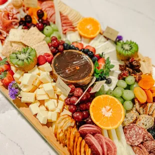 a platter of fruit and cheese