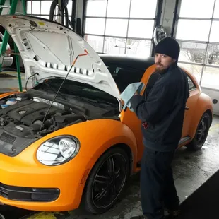 Sean finishing up an oil change we do all makes and models