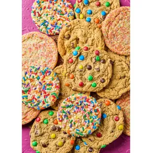 a pile of cookies with sprinkles