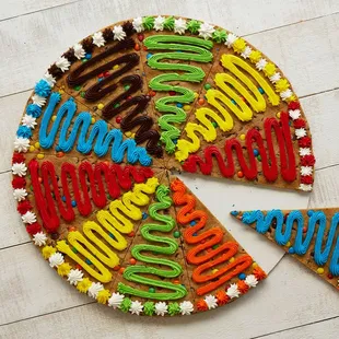 a piece of a cookie with the word happy birthday written on it